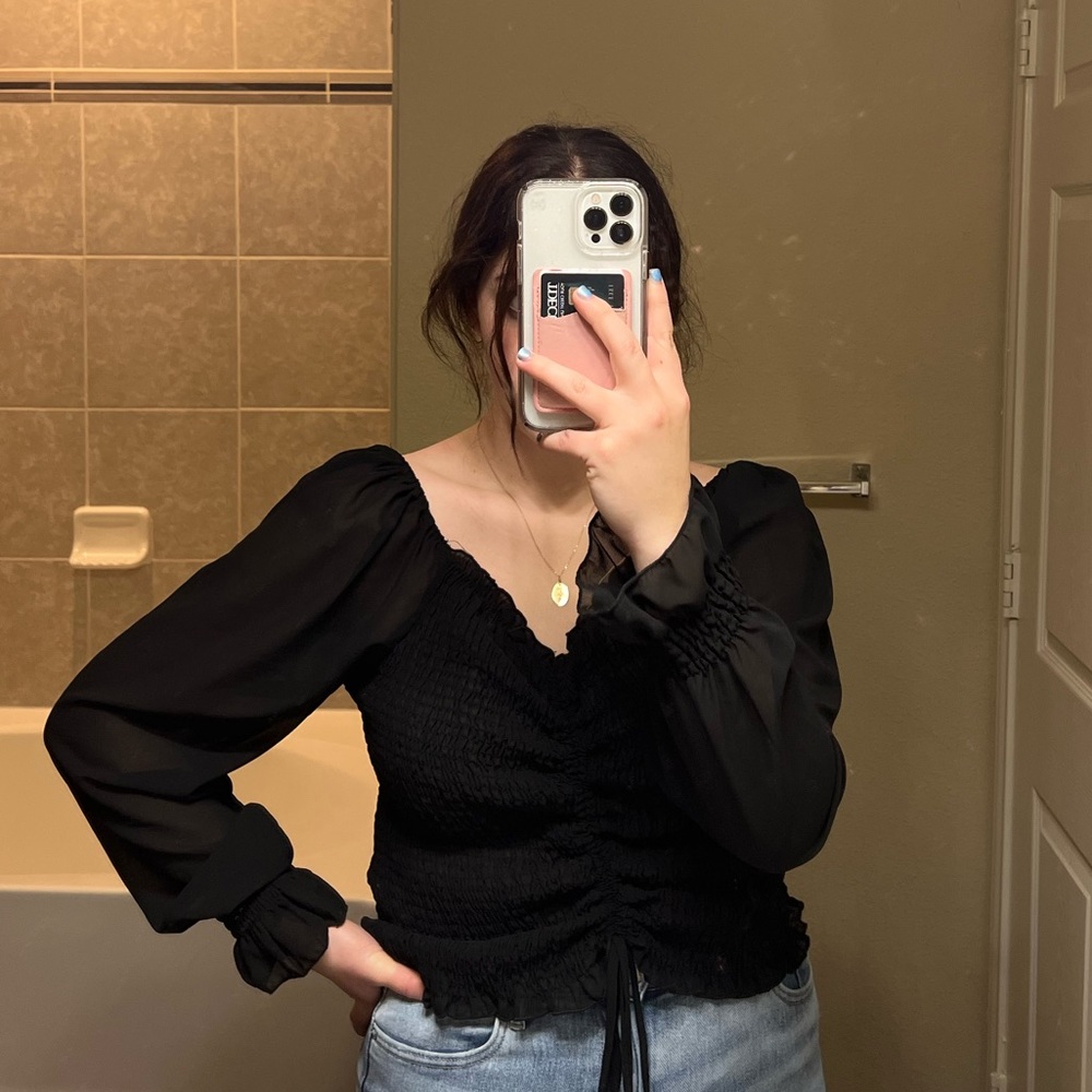 Gorgeous black blouse long sleeves, adjustable torso.